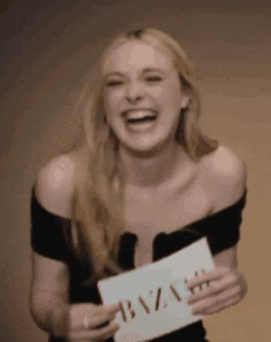 a woman is holding a sign that says bazaar