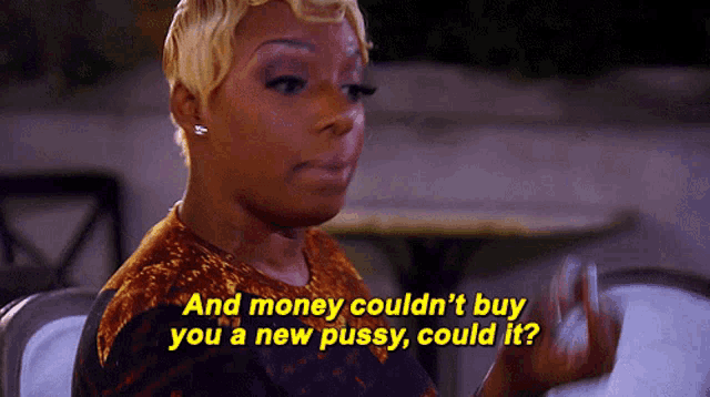 a woman is sitting at a table with the words and money could n't buy you a new pussy , could it ?