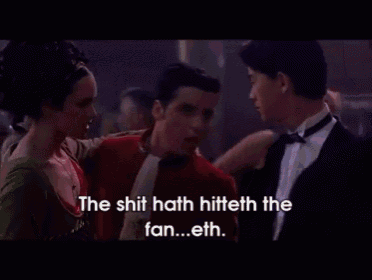 a man in a tuxedo and a woman in a green dress are dancing with the words the shit hath hiteth the fan
