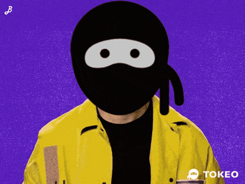 a person wearing a yellow jacket and a black mask with the word tokeo on the bottom right