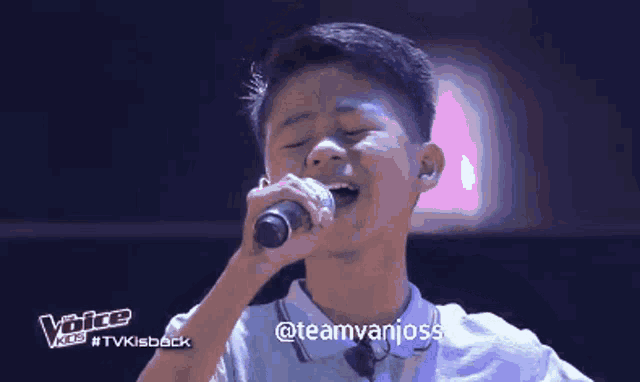 a young boy singing into a microphone with the words voice kids #tvkisback below him