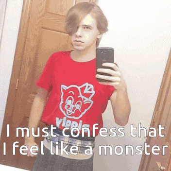 a boy is taking a selfie in a mirror while wearing a red shirt that says vipps