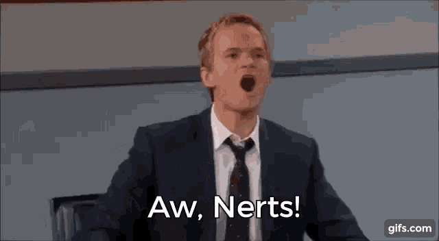 a man in a suit and tie is saying aw , nerts !