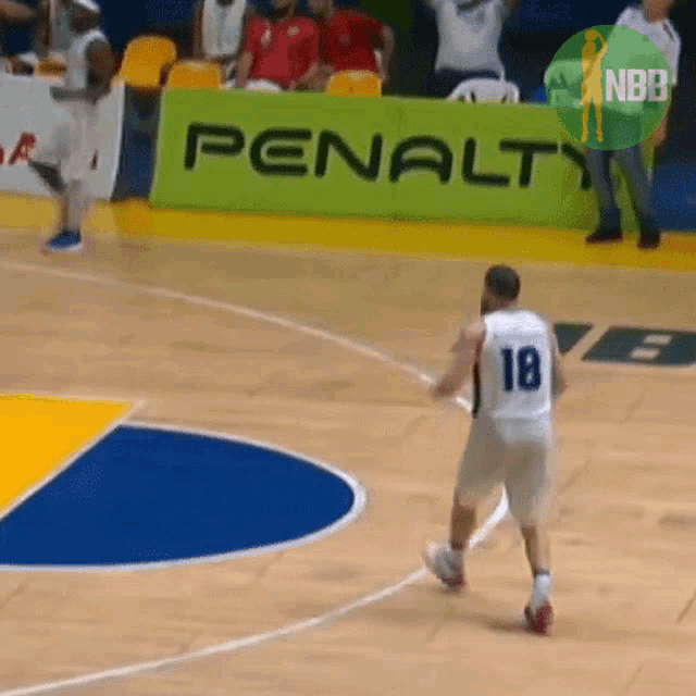 a basketball player with the number 18 on the back of his shirt