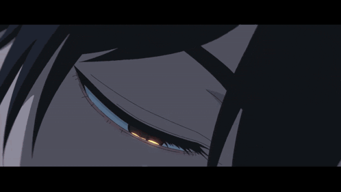 a close up of a cartoon character 's eye with a blue pupil