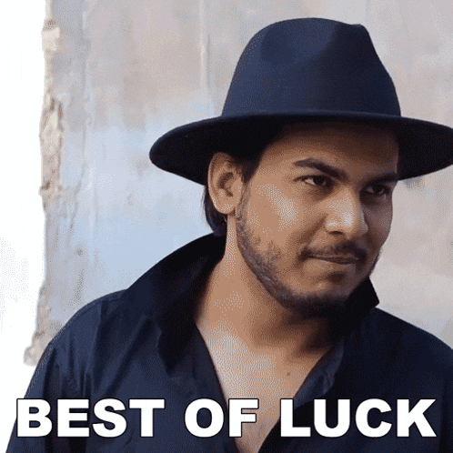 a man wearing a hat with the words best of luck written on it