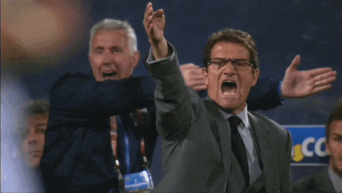 a man in a suit and tie is yelling in front of a sign that says ccc