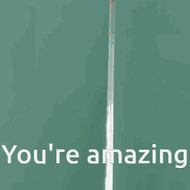 a man in a red shirt says you 're amazing in white letters