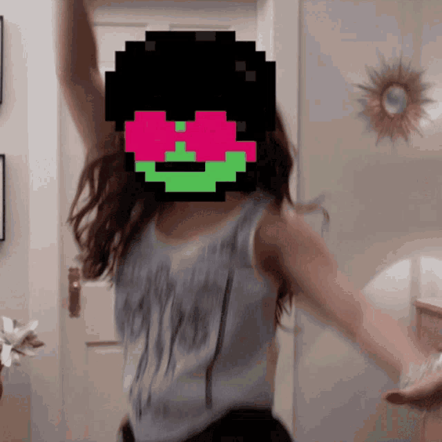 a pixel art of a girl dancing with a smiley face on her face
