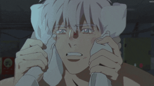 a man with a towel around his neck is crying in a cartoon