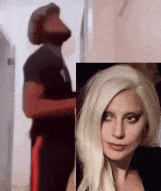a woman with blonde hair is standing next to a man in a black shirt