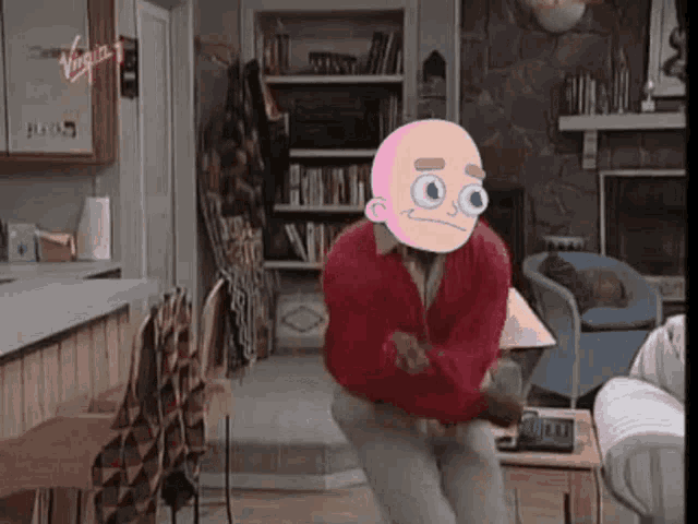 a man in a red jacket is dancing in a living room with a cartoon character on his head .
