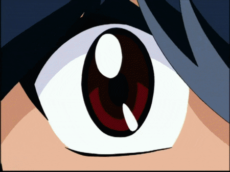 a close up of a cartoon character 's eye with a red pupil