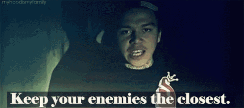 a man says keep your enemies the closest in front of a dark background
