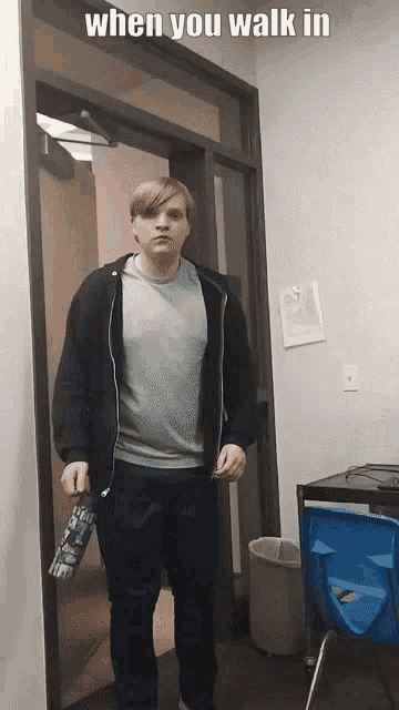 a man standing in a doorway with the words when you walk in on the bottom