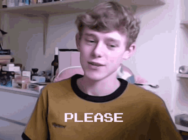 a young man in a yellow shirt with the word please written on it