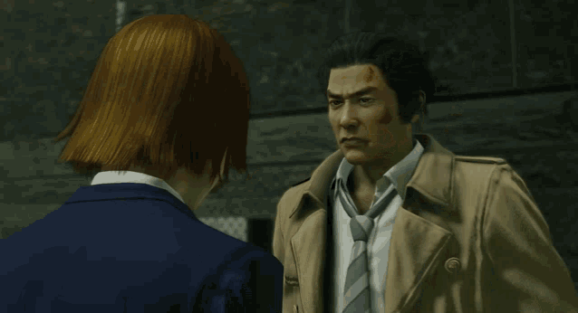 a man in a trench coat talks to a woman in a blue suit