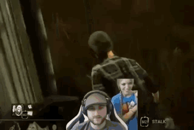 a man wearing headphones and a hat is playing a video game with a woman .