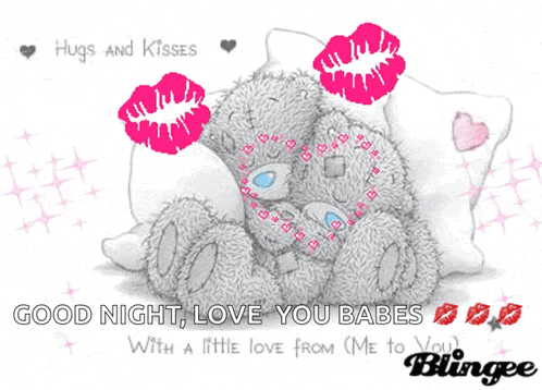 a teddy bear laying on a pillow with hugs and kisses
