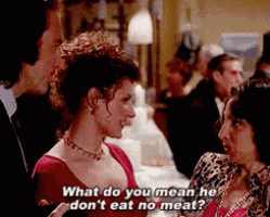 a woman in a red dress says what do you mean he don 't eat no meat ..