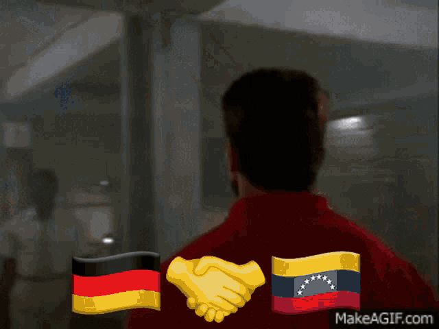 a man shaking hands with a german flag and a venezuelan flag on his back