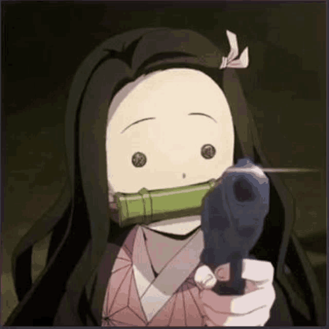 a girl is holding a gun in her hand and pointing it at the camera .
