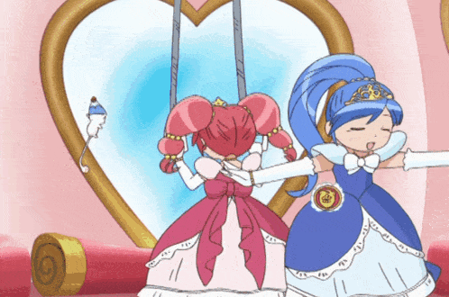 two princesses are standing next to each other in front of a mirror