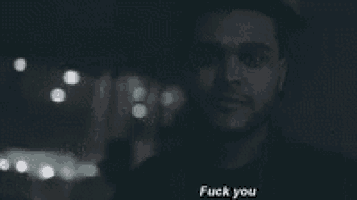 a close up of a man 's face with the words " fuck you " on the bottom