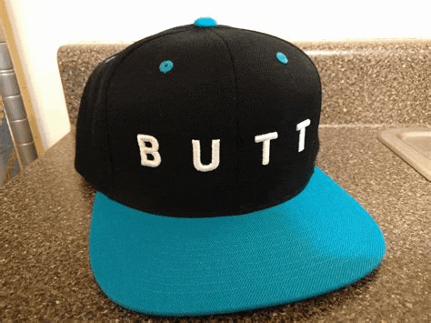 a black hat with the word butt written on it