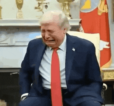 a man in a suit and tie is crying .