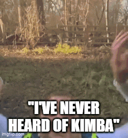 a man says " i 've never heard of kimba " in front of a fence