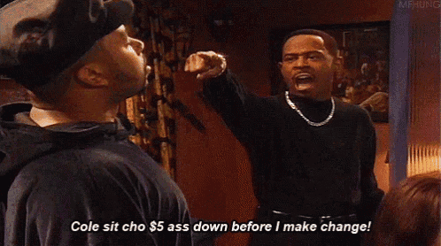 a man is pointing at another man and says cole sit cho $ 5 ass down before i make change !
