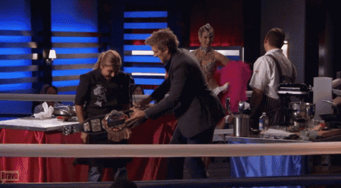 a group of people are standing in a boxing ring with bravo written on the red table cloth