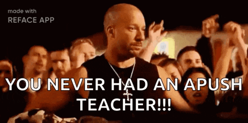 a bald man is standing in front of a crowd of people and says `` you never had an apush teacher ! ''
