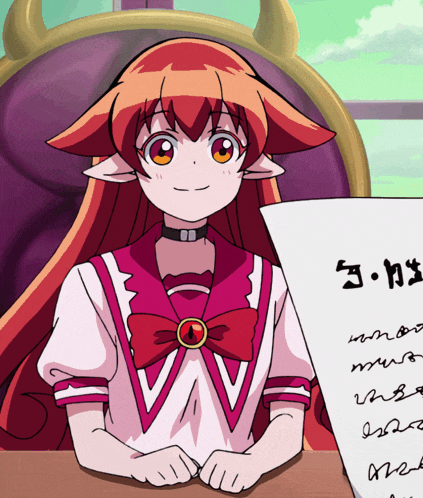 a girl with red hair is sitting at a table holding a piece of paper that says ' j.k. ' on it