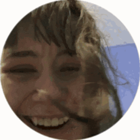 a close up of a woman 's face in a circle .
