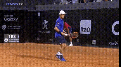 a tennis player on a court with ads for samsung galaxy peugeot and claro