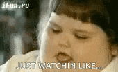 a close up of a baby 's face with the words `` just watchin like ... '' written on it .