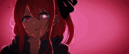 a girl with red hair is making a silly face