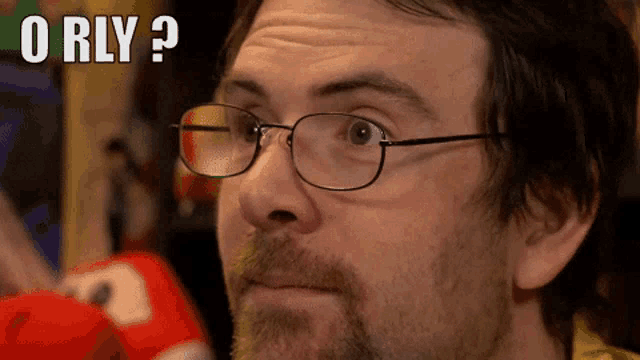a man with glasses and a beard is asking the question " orly "