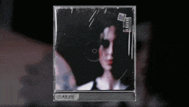 a cd case with a picture of a man and the words mini disc