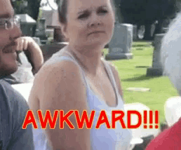 a woman in a white tank top says awkward in red