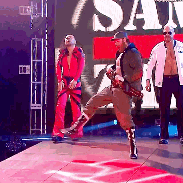 a group of men are standing on a stage in front of a sign that says ' the next generation '