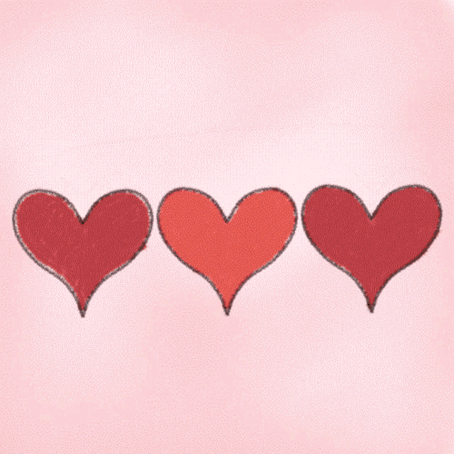 three red hearts are lined up in a row against a pink background