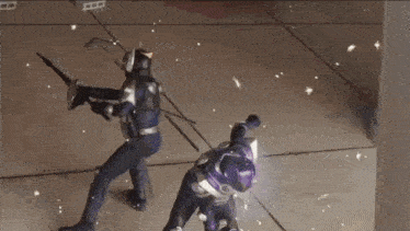a man in a purple costume is walking in a large building