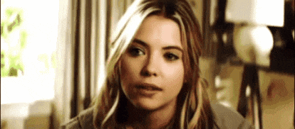 a close up of a woman 's face looking at the camera .