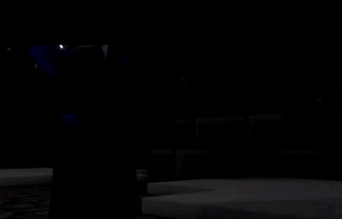 a minecraft character is standing in a dark room with a sword