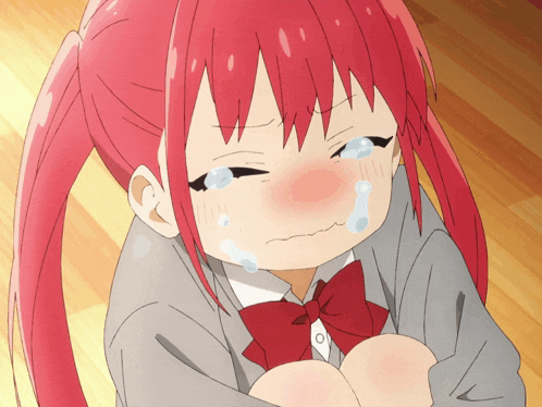 a girl with red hair is crying and has tears coming out of her eyes