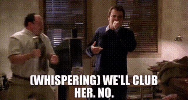 two men are standing next to each other in a room and one of them is whispering we 'll club her no .