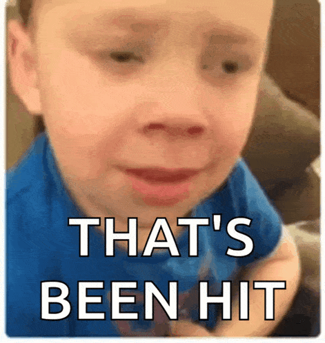 a little boy is crying with the words that 's been hit on the bottom